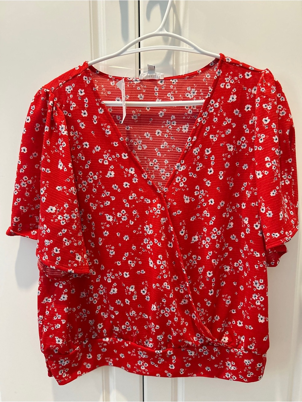 Red and white floral flowy cross-over top